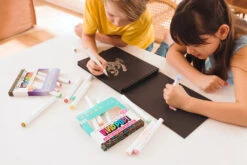 Vivid Pop! Water Based Paint Markers - Pastel - Set Of 8 | OOLY(Vivid Pop Water Based Paint Markers Pastel Set Of 8 Ooly) -Curious Bear Toys Store Two kids coloring on black paper pad with OOLY Vivid Pop Paint Markers a4985c39 e62a 4986 94fa 69a9f9416ace